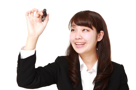 young Japanese businesswoman draw in the airの写真素材