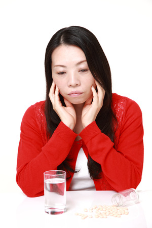 Japanese woman suffers from melancholyの写真素材