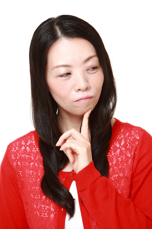 Japanese woman worriesの写真素材