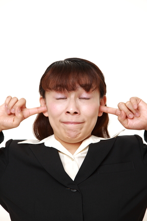 businesswoman suffers from noiseの写真素材