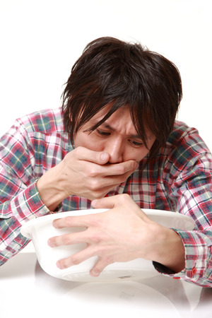 young Japanese man vomitの写真素材