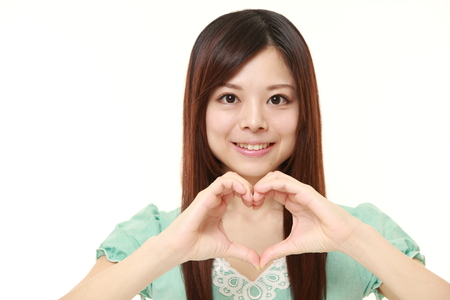 Japanese woman with heartの写真素材