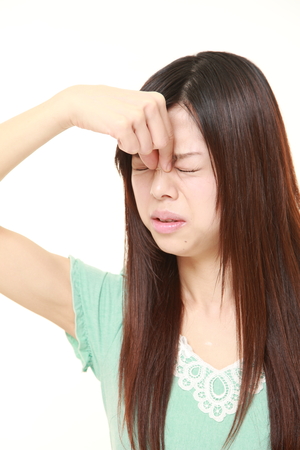 woman suffers from Asthenopiaの写真素材