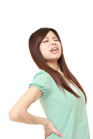 Japanese woman suffers from lumbagoの写真素材