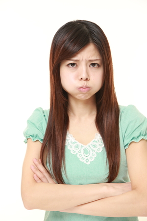 angry young Japanese womanの写真素材