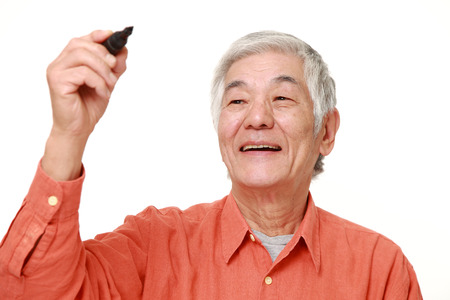 senior Japanese man draw in the airの写真素材