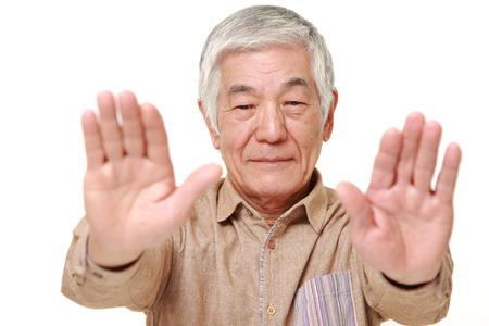 senior Japanese man making stop gestureの写真素材