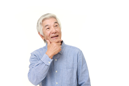 senior Japanese man dreaming at his futureの写真素材