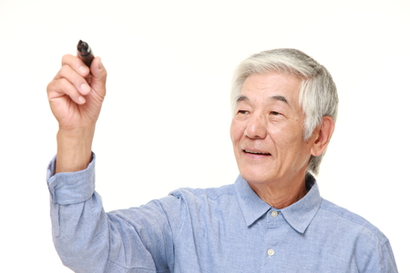 senior Japanese man draw in the airの写真素材