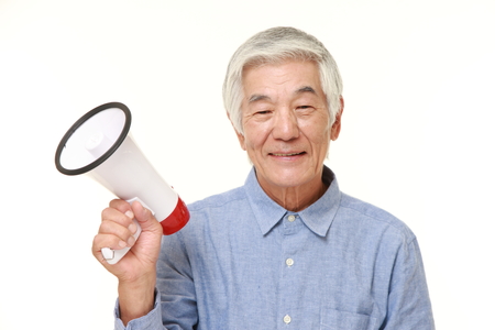 senior Japanese man with megaphoneの写真素材