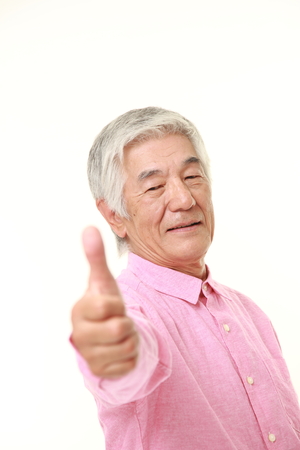 senior Japanese man with thumbs up gestureの写真素材