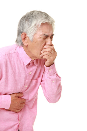 senior Japanese man feels like vomitingの写真素材