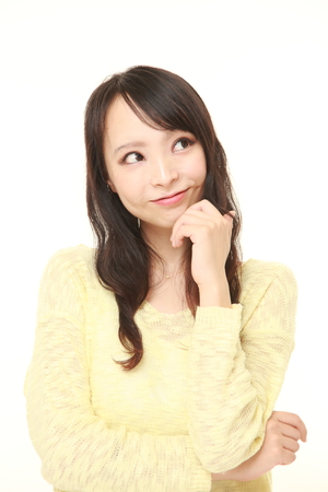 young Japanese woman dreaming at her futureの写真素材