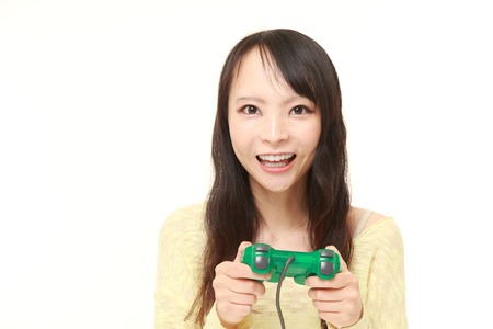 young Japanese woman enjoying a video game