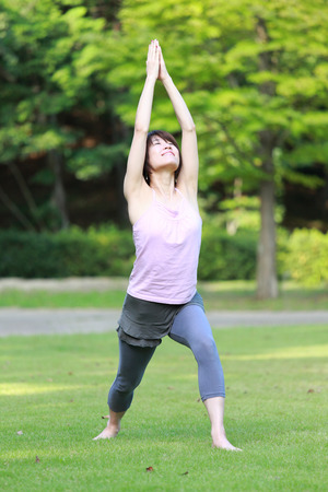 Japanese Woman Doing YOGA "warrior III pose"の写真素材