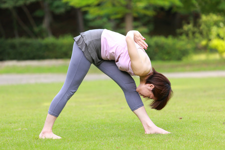 Japanese Woman Doing YOGA "Intense Side Stretch Pose"の写真素材