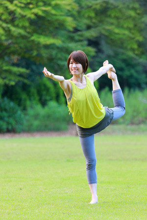 Japanese Woman Doing YOGA "lord of the dance pose"の写真素材