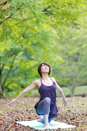 Japanese Woman Doing YOGAの写真素材