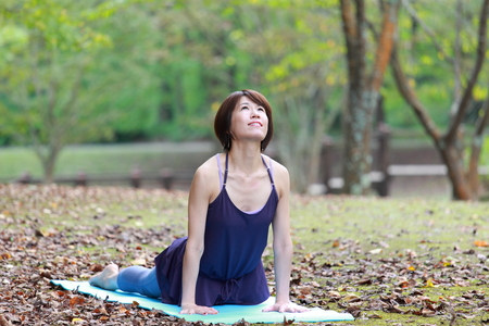 Japanese Woman Doing YOGA "cobra pose"の写真素材