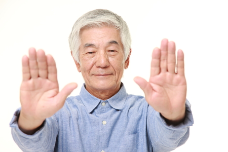 senior Japanese man making stop gestureの写真素材
