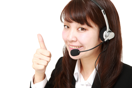 young Japanese businesswoman with thumbs up gestureの写真素材