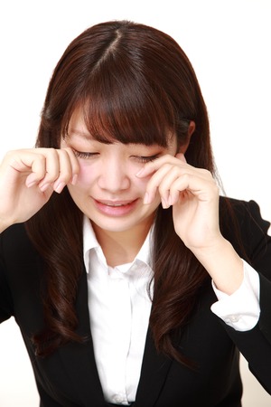young Japanese businesswoman criesの写真素材