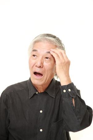senior Japanese man suffers from headacheの写真素材