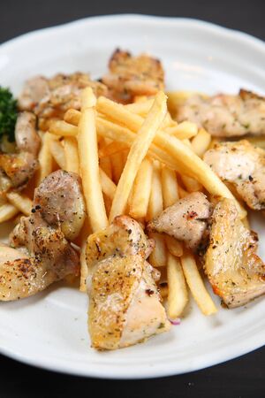 chicken basil with French friesの写真素材