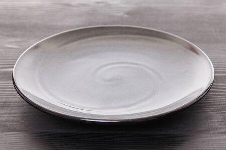 empty dish on a dining tableの写真素材
