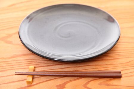empty Japanese dish with chopsticksの写真素材