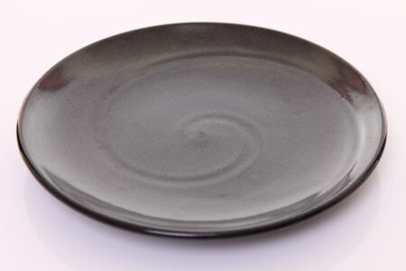 empty dish on a dining tableの写真素材