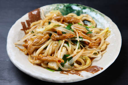 fried udon noodles with innardsの写真素材