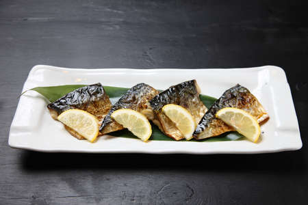 broil mackerel with sliced lemonの写真素材