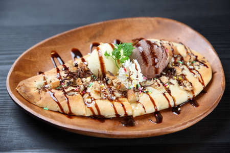 ice cream and naan with chocolate sauceの写真素材