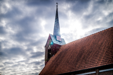 germany - east frisia - a church against the cloudy skyの写真素材