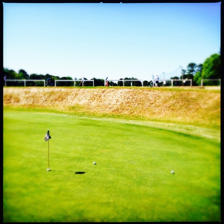 People practicing golfing at a public course in Atlanta, Georgia USAの素材