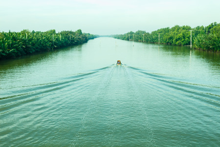 The boat was sailing on the river