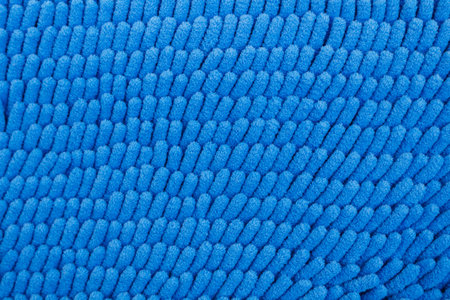 Beautiful carpets made from synthetic blue backdrop.