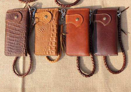 wallet of leather crocodile skin on sack clothの写真素材