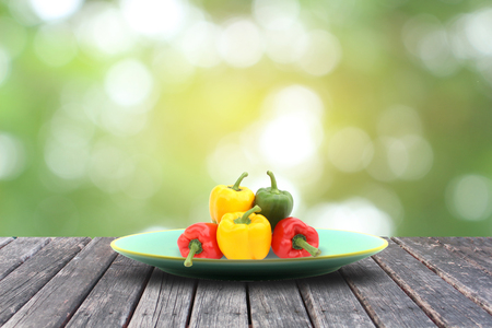 sweet peppers on wood tableの写真素材