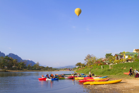 Colorful hot air balloon over Song river Vang Vieng, Laosのeditorial素材