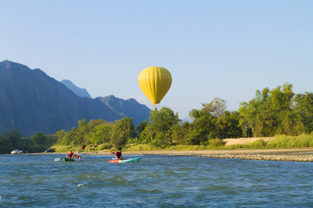  Colorful hot air balloon over Song river Vang Vieng, Laosのeditorial素材