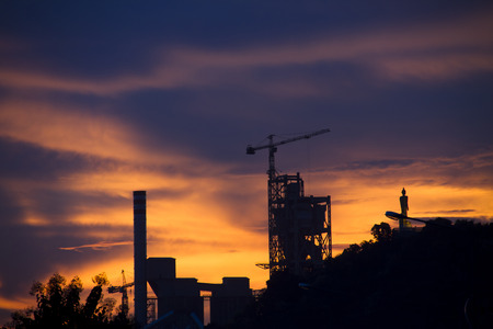 Industrial plant at dusk in Thailandの写真素材
