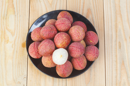 fresh lychees on wooden backgroundの写真素材