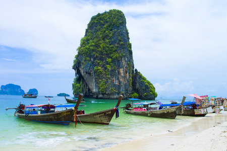 Ao Nang  is a great spot to hitch a ride on a longtail boat to explore the magical neighboring beaches & islands, Railay, Koh Phi Phi, Poda Beach , Koh Chicken , Maya Beach.This picture have many ships.のeditorial素材