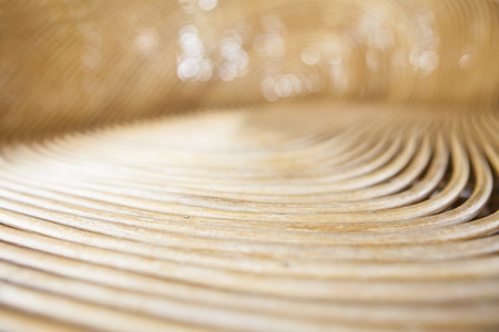 Cane or wickerwork background- showing the details of interlaced weave structure of basket or furniture,Abstract background from natural rattan. Handmade weaving.の写真素材