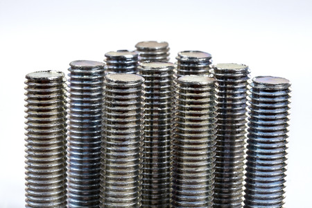 metal screw or bolt and nuts isolated on white background.