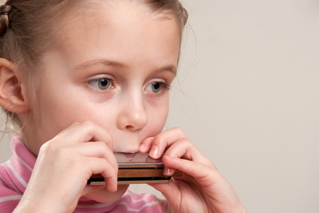 Young girl play blues harmonicaの写真素材