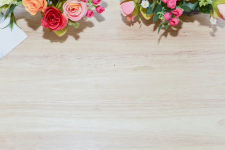 Vivid color effect.Blurry Flowers bouquet shoot soft focus arrange for decoration on wood background.With copy space.の写真素材