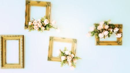 Blurry Green Wooden frame with flowers on the wall.の写真素材